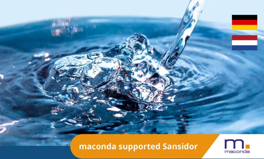 maconda News Deal Banner – Sansidor x Environmental Hygiene Marburg 250916 - maconda Close up of water splashes with German and Dutch flags orange banner maconda supported Sansidor with maconda logo
